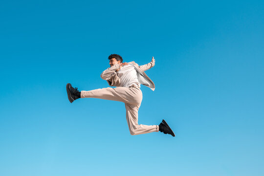 Stuntman flying in the air with blue sky
