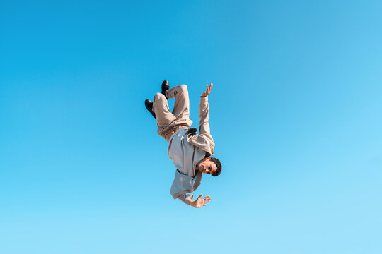 Stuntman flying in the air with blue sky