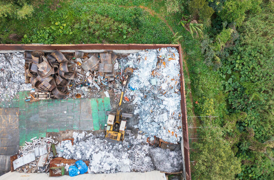 Aerial View of Recycling Plant with Excavator