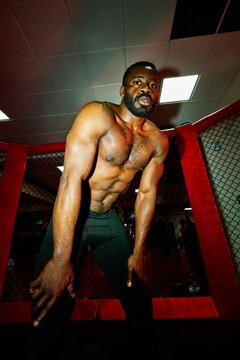 Black shirtless boxer on ring