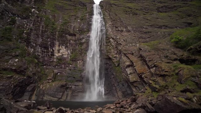 Waterfall drops into rocky pool in Serra da Canastra, Minas Gerais, Brazil