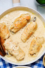 Traditional Ukrainian chicken rolls with prunes in creamy sauce, kruchenyky .top veiw