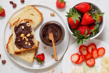 Brioche slices with homemade Nutella, strawberries and bananas