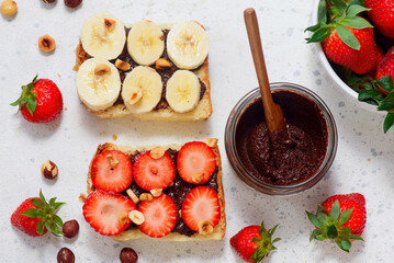Brioche slices with homemade Nutella, strawberries and bananas