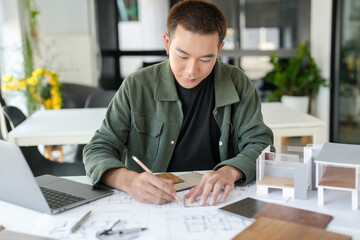 Fototapeta premium Architecture interior Asianman Creative project plan&nbsp;designer home and Choose interior materials drawing interior on blueprint.