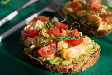 Italian bruschetta with omelette, tomatoes and herbs. A balanced breakfast
