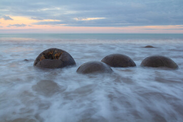 Dinosaur Egg Rocks or Moeraki Rocks are a group of strange rocks formed by natural phenomena of...