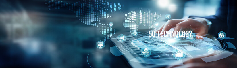 A man using a laptop analyzes networks for 5G technology. Use latency, bandwidth, and encryption to...