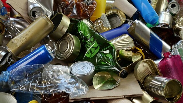 Plastic glass metal paper cardboard waste and recycling. Sorted recyclables materials. Waste sorting center. Recycling collection