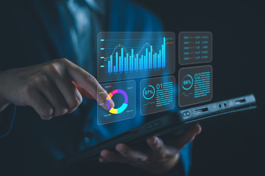 Analyzing Key Performance Indicators, Businessman using virtual screen to analyze key performance indicators KPI with various graphs and charts, showcasing data analysis and performance tracking