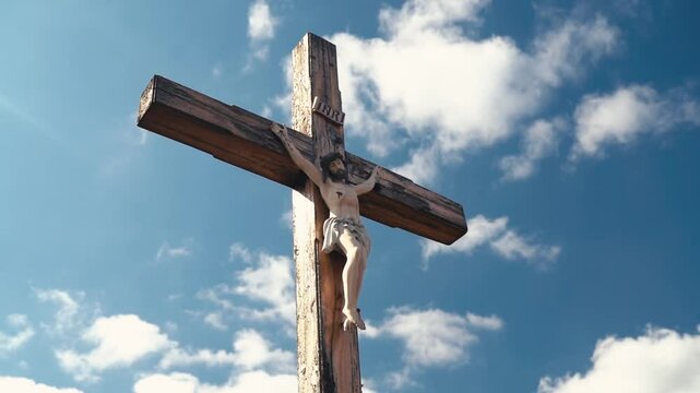 Crucifixion of Christ against the sky background. Catholicism, Christianity, faith concept. The initialism INRI Iesus Nazarenus, Rex Iudaeorum represents the Latin inscription in English translates to