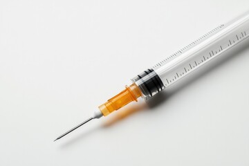 Fototapeta premium Syringe with orange liquid showcases precision and medical readi