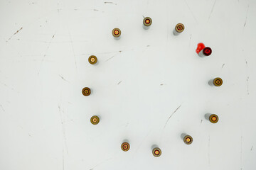 Metaphor of Bullet casings mimicking the EU flag's circle of stars. There is one bloody bullet casing. Several European Union countries have potential threat of Russian military aggression. Minimalism