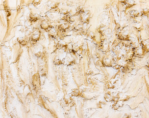 A wall with a lot of dirt and sand on it