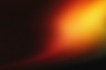 Abstract orange and red light leak on black background.