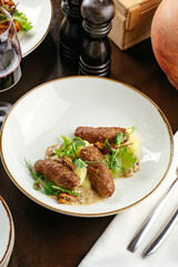 mashed potatoes with beef patties and gravy