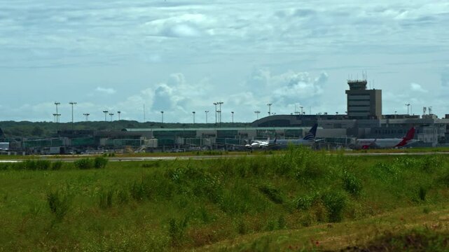 Tracking shot of a small plane landing at the Tocumen International Airport