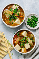 Traditional Japanese Miso Soup with Chinese Cabbage and Tofu in bowls .style hugge