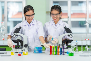 Two Asian female researchers in the lab spent months perfecting an experiment that tested the...