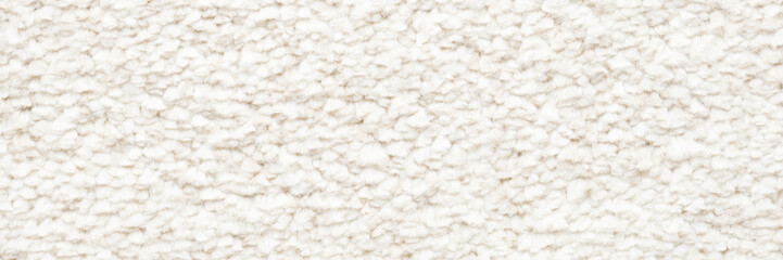 White new fluffy home carpet background. Wide banner. Closeup. Empty place for text. Top down view.