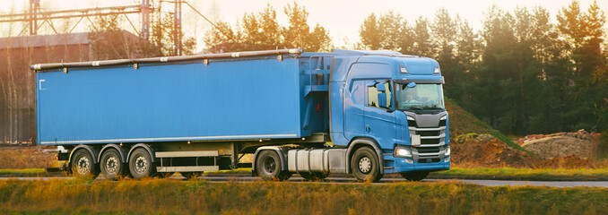 Large trailer truck driving on highway
