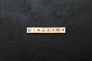GLAUCOMA word written on wood block. GLAUCOMA text on cement table for your desing, concept