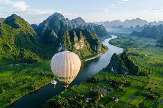 Serene hot air balloon flight over lush river valley and majestic mountains - Powered by Adobe
