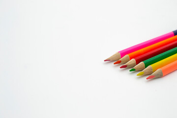 colored pencils on white background