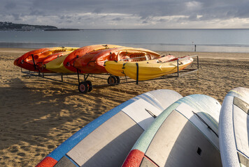 windsurfing board stored on a trolley on the beach of Saint-Cast-Le-Guildo in summer in Côtes d'Armor, Brittany, France