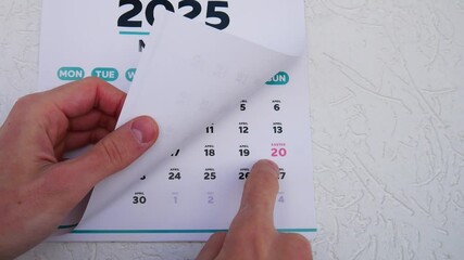 Close-up of the marked Easter date on a wall calendar 2025 page