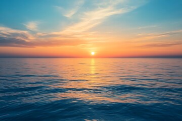 Fototapeta premium Ocean Sunset with Vibrant Skyline and Sun Reflection on Waves, Blue and Gold