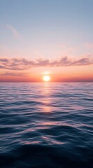 Fototapeta premium Serene Ocean Waves Under a Pink Sky During Sunset Reflecting Sunlight on Water