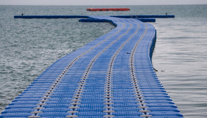 Plastic and wooden floating walk way floating in the sea in Island,Krabi,Thailand