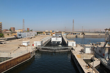 Obraz premium View of cruise ship pass through the Esna Lock on the River Nile, Egypt