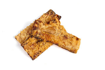 Banana chips snack isolated on white background. Snack made from banana slices coated in flour and then fried until cooked.