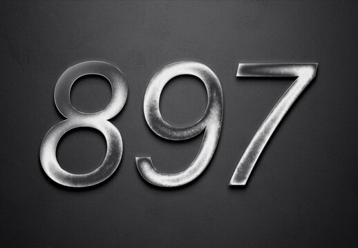 Chrome metal 3D number design of 897 on grey background.