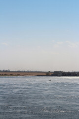 Fishermen in their rowing boat near the Esna Lock on the River Nile, Egypt