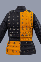 Two-Tone Medieval Brigandine Armor with Buckles. Unique torso protection featuring contrasting yellow and black panels with decorative rivets and leather strap closures.