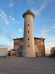 Lighthouse building in Bibione at sunset. Vertical.