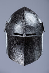 Darkened Steel Medieval Knight Helmet. Battle-worn head protection with narrow eye slits.