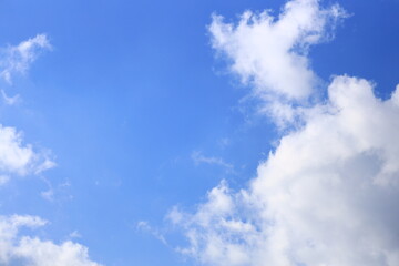 White clouds in a blue bright sky.