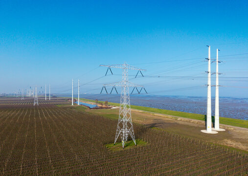 Aerial view of power lines over agricultural fields in the Netherlands