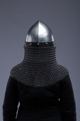 Norman Helmet with Chainmail Aventail. Medieval head protection with nasal bar and attached chainmail neck guard.