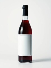 Obraz premium Red wine bottle on a white background 