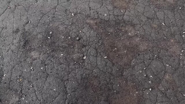 Broken cracked asphalt in the city