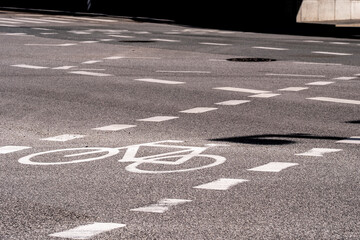 Bike lane detail on smooth asphalt in Ørestad, Copenhagen. Clean markings, directional flow and strong geometry for city infrastructure and urban planning themes.