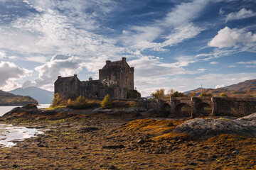 Fototapeta premium Eilean Donan, castle, Scotland, Highlands, autumn, fall, mist, sunrise, sunset, golden, reflection, loch, valley, landscape, scenic, nature, travel, adventure, photography, iconic, historic, remote, w
