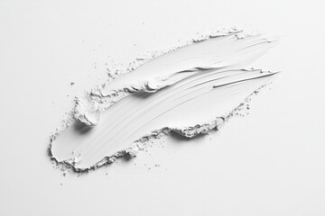 Naklejka premium Smooth white paint spread across a clean surface, showcasing texture and consistency during an artistic project