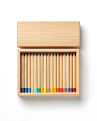 Naklejka premium Wooden box filled with colorful pencils on a white background, top view.