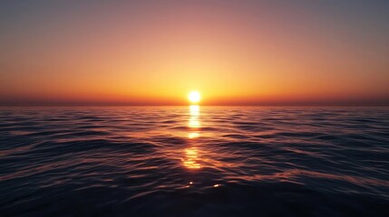 Obraz premium Sunset over the ocean scenic view with vibrant sky and dramatic dusk concept. A beautiful sunset over calm ocean waters, creating serene reflections.